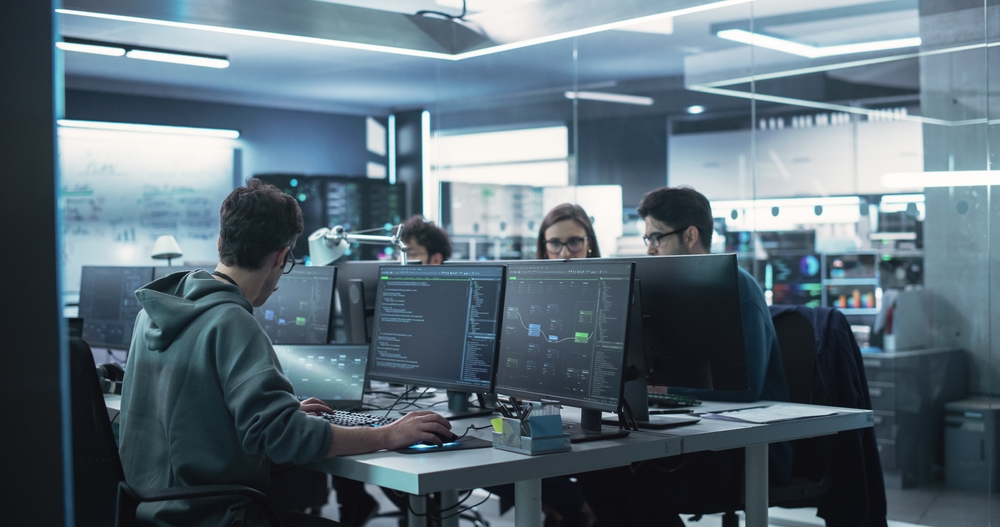 CFO reviewing the financial exposure of lost business software source code in 2026, with a categorized risk assessment on the desk