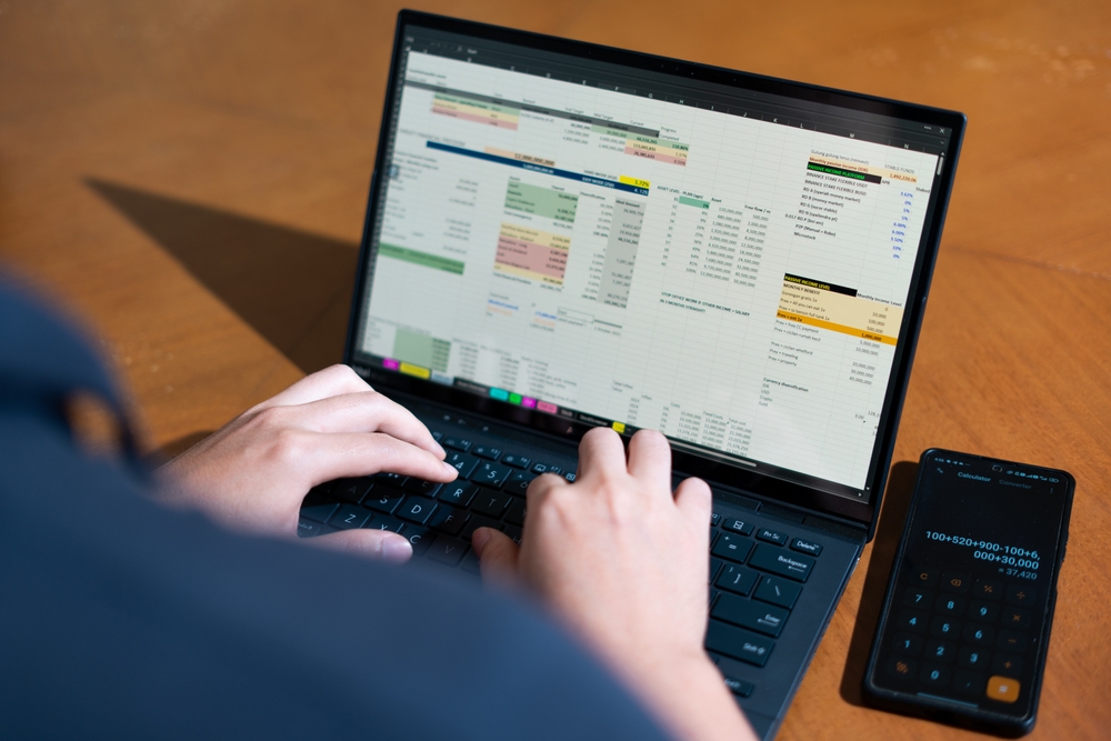 An operations team working together on a shared business database after migrating from an Excel spreadsheet to SQL Server in 2026